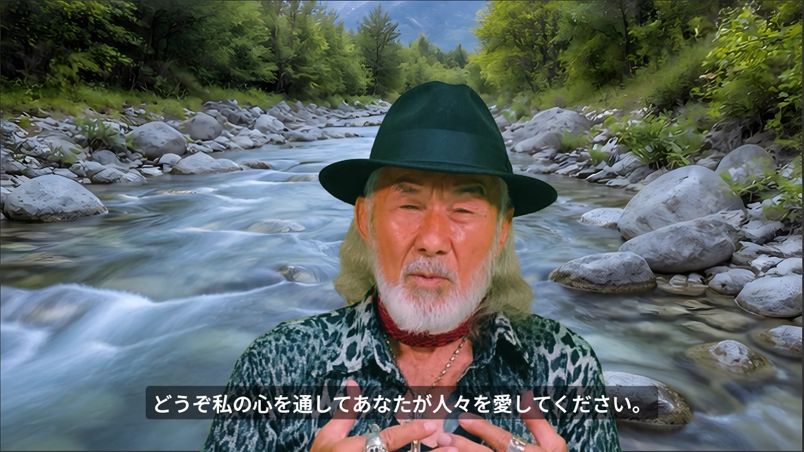 川を背景に心を通して人を愛する祈りを語るアーサー先生