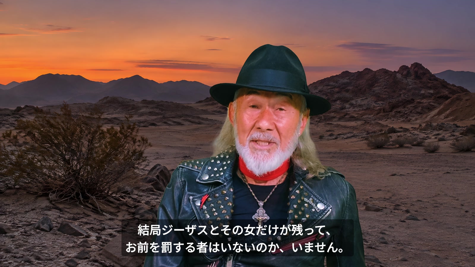 砂漠を背景に、女性を守ったジーザスについて語るアーサー先生。
